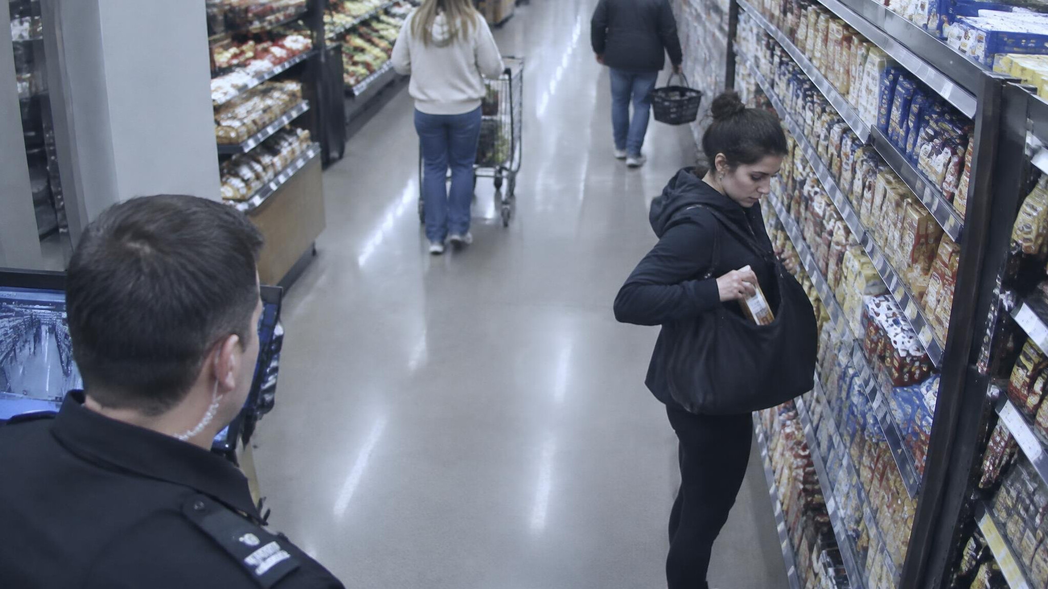 store detective monitoring shoppers